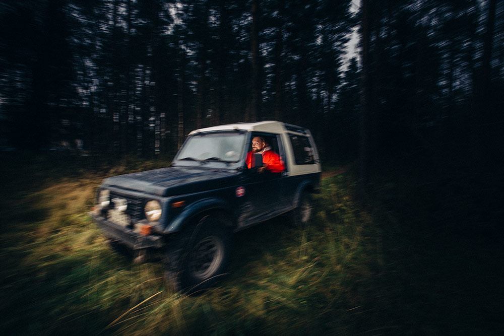 Jari Ruokonen riding car in a forest